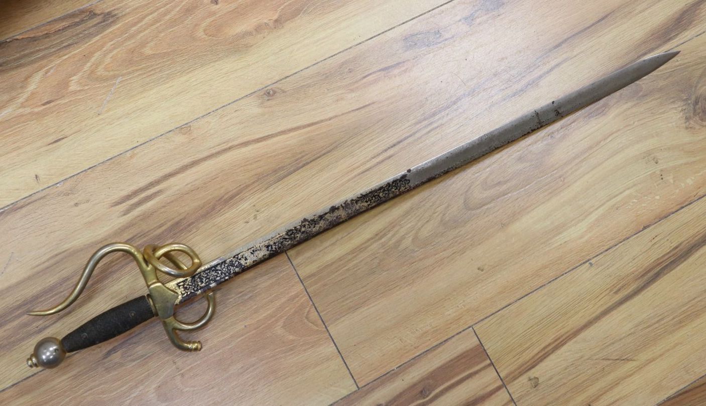 An officers sword with cast hilt and etched, 61cm double-edged blade